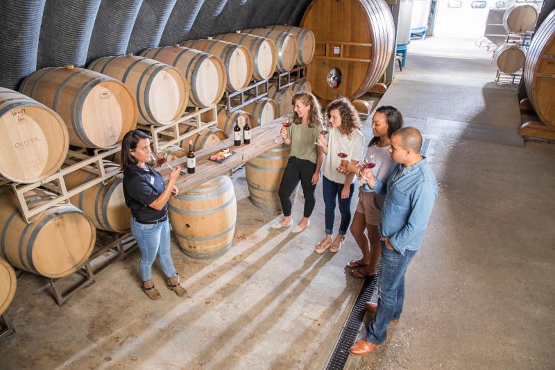 A small group on a tasting tour at Oliver Winery