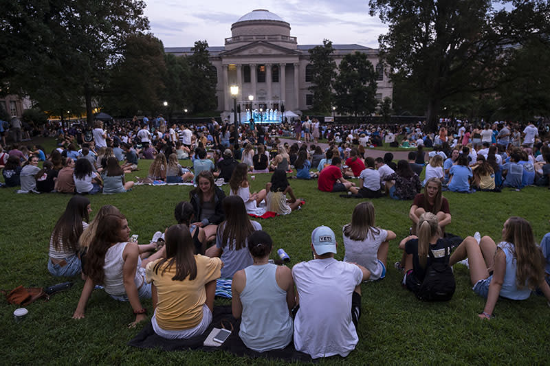 Sitting on Polk Place during Week of Welcome