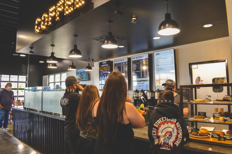 people in line at a coffee shop