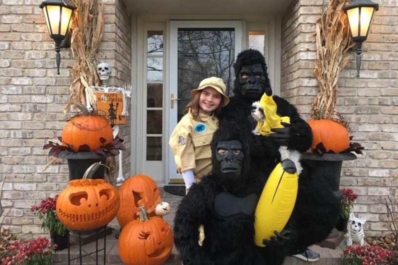 Siblings and their dog dressed in a group costume for Halloween