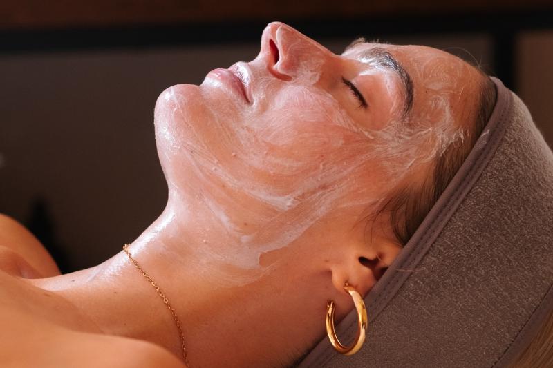 Woman relaxing during facial
