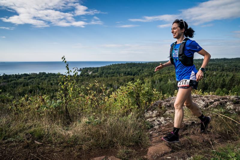 A woman running on trails in Cook County