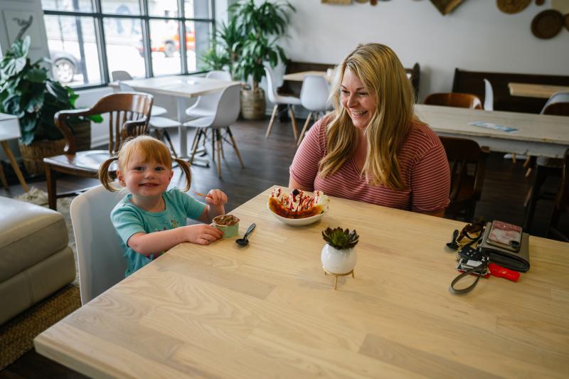 A little girl and her mother enjoying gelato at The Dreamery