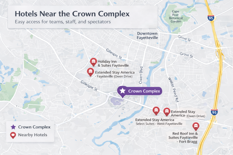 Map showing the Crown Complex in Fayetteville, North Carolina, highlighted in purple, with nearby hotels marked in red to illustrate convenient lodging options close to the venue.