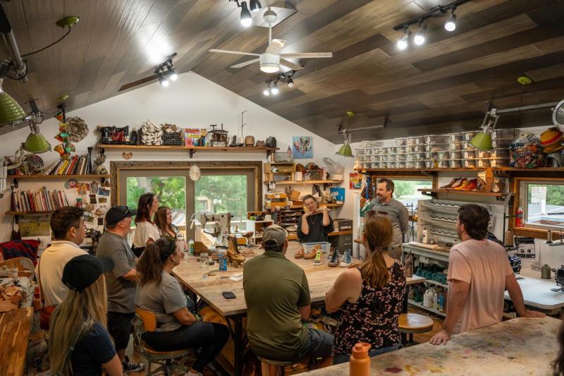A group touring Colorado Shoe School.
