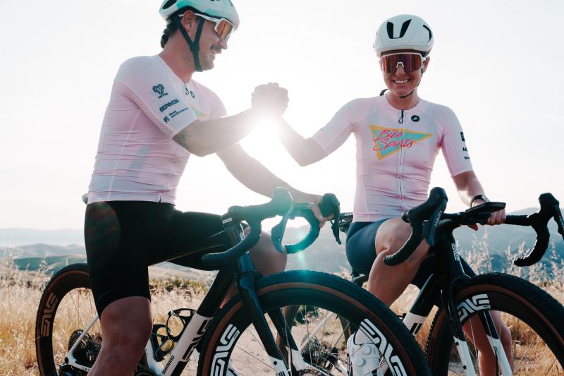 Two bikers handshaking and smiling after a good ride!