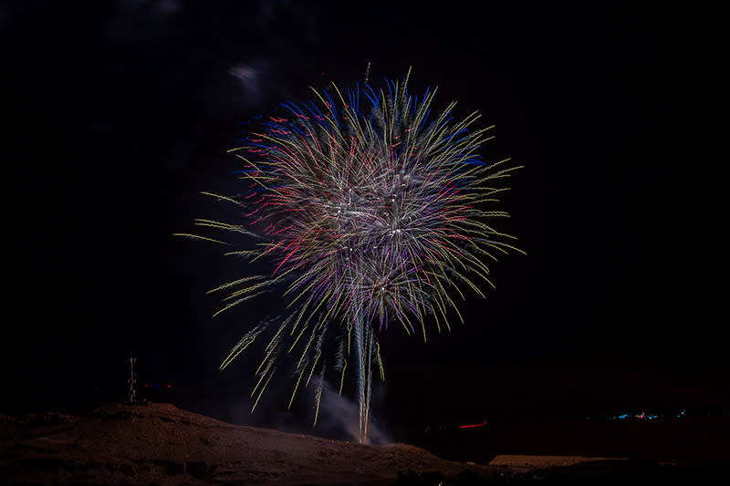 A firework illuminating the night sky in Moab on the Fourth of July.