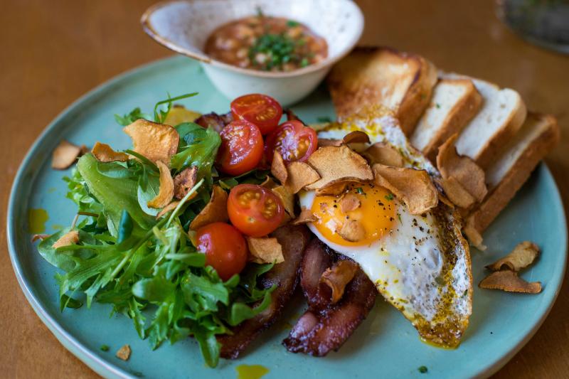 Toast, egg and salad on a plate