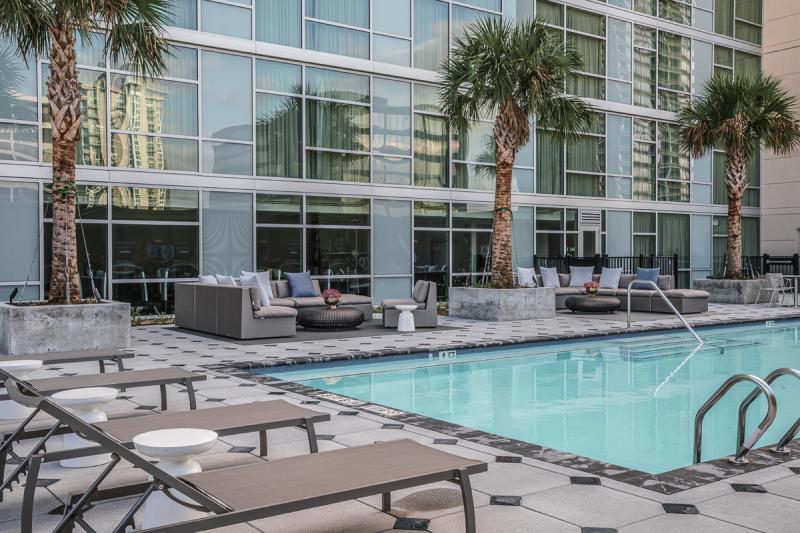 Lounge chairs line the pool at Houston's Hyatt Regency Hotel Galleria