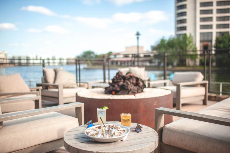 Oysters at Pacific Table around firepit with a lake view