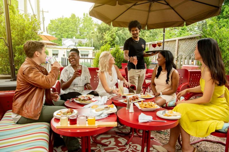Visitors enjoying outdoor dining at a Loudoun County restaurant as part of a weekend getaway
