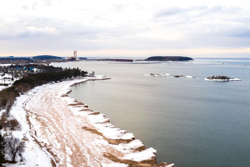 An aerial view showing the built up shelf ice along the Superior shore