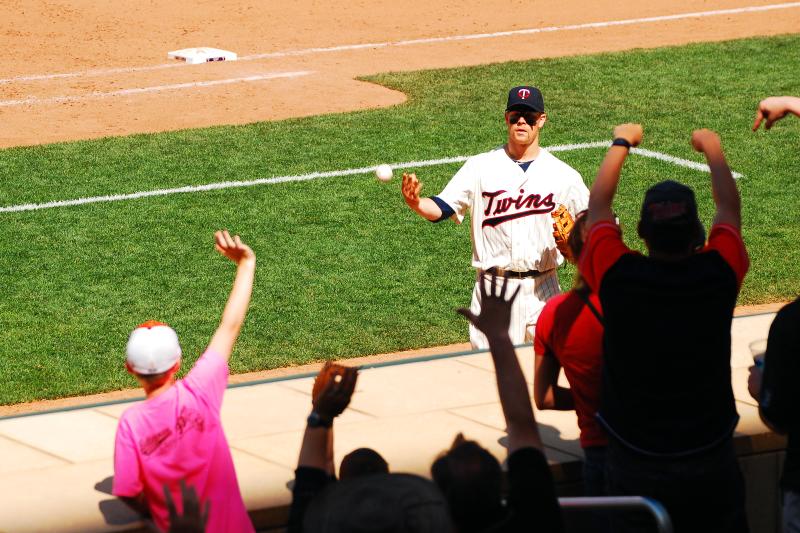 Twins Player Tossing Baseball to Kid