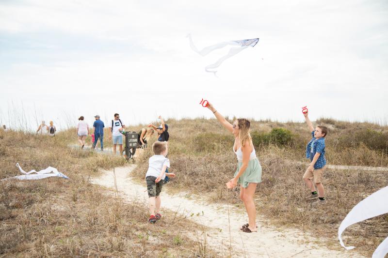 Families flying kites at the kite festival at Huntington Beach