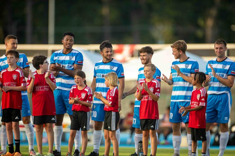 Lionsbridge FC with kids