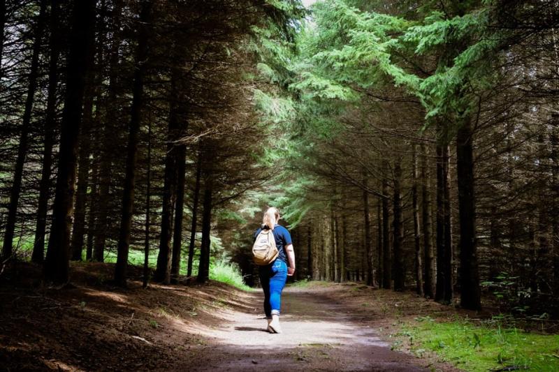 Woman walking in the woods