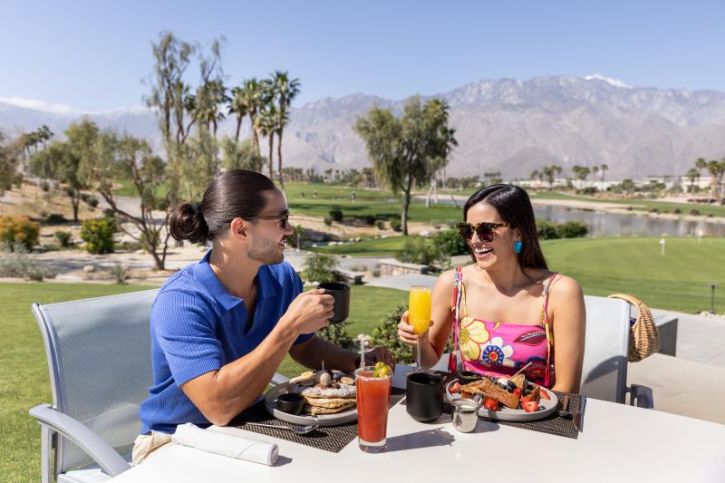 A couple dining at escena golf resort.