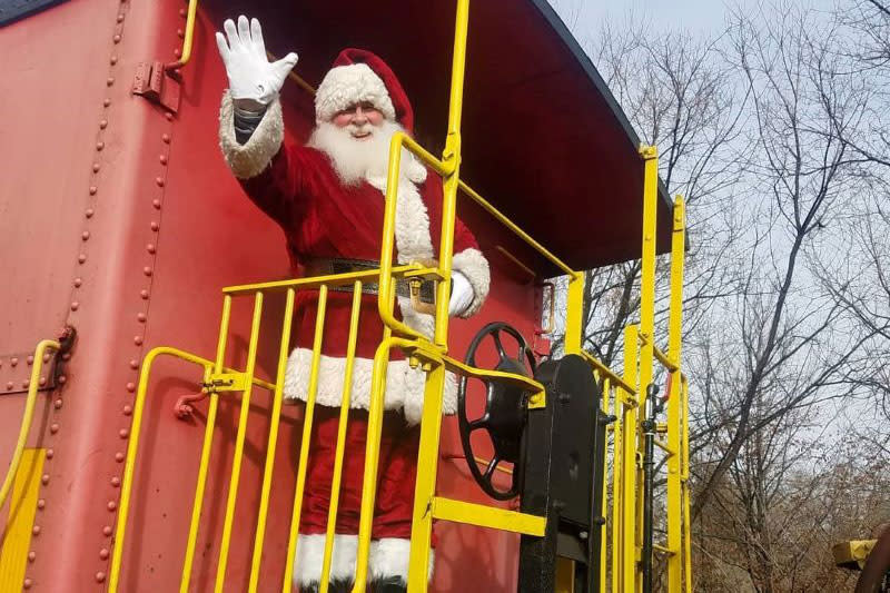 Santa on the back train waiving