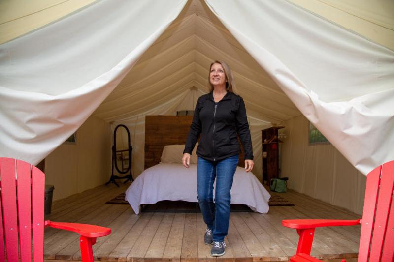 woman in glamping tent