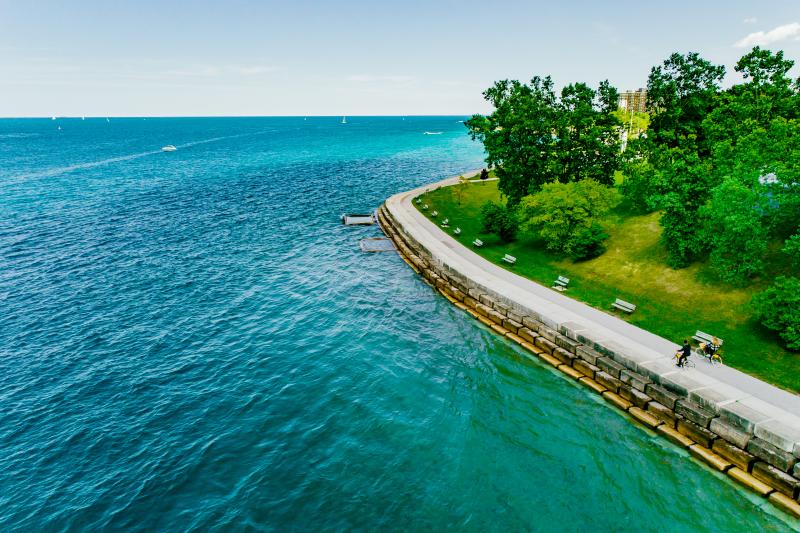 2 people cycling along waterfront trail