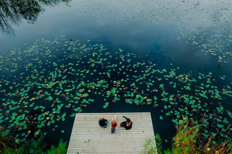 3 women on dock at conservation area