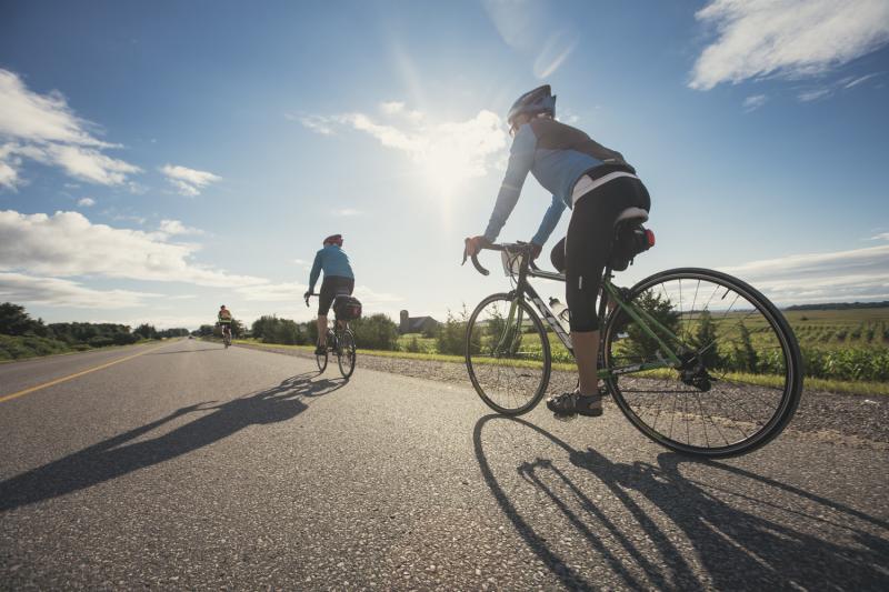 2 people on road cycling