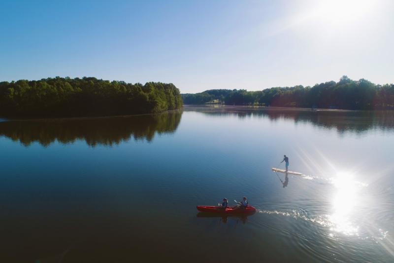 kayaking and paddleboarding on a lake