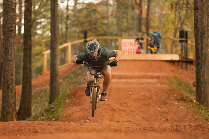 Cyclist hitting a dirt jump at the Vic Bailey Bike Park