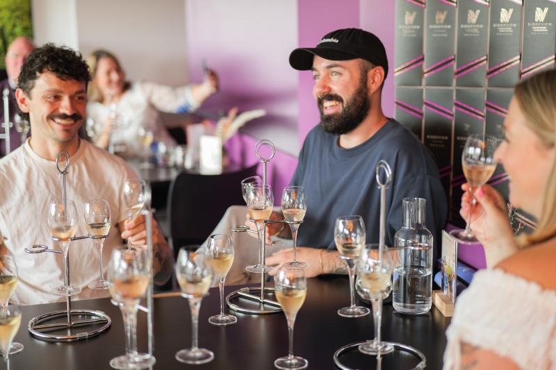 A group enjoys wine tasting at Ridgeview Wine Estate in Sussex