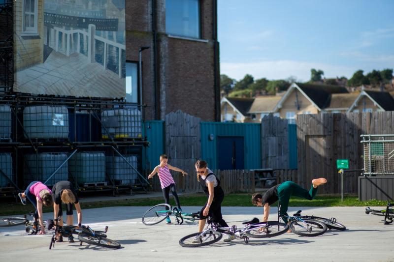 A group performing Bicycle Ballet at the Sidings in Newhaven, Sussex