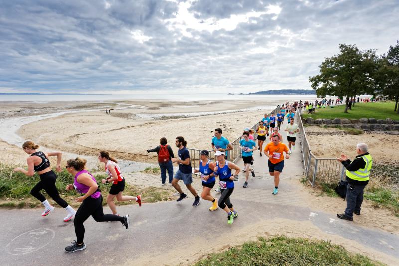 Runners in the Swansea Bay 10k running along Swansea Bay