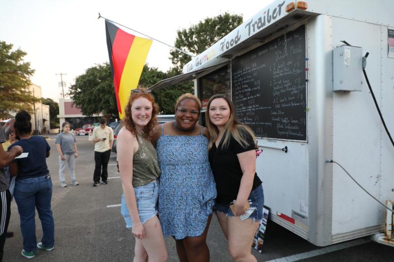 3 women in front of a food truck