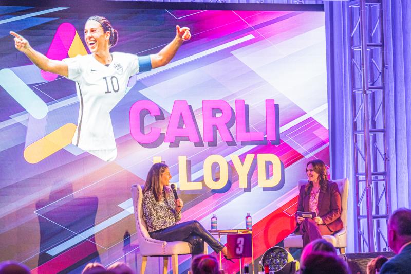 USWNT Gold Medalist Carli Lloyd and VFTCB's Rachel Riley on stage at the VFTCB Annual Luncheon
