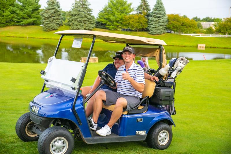 Golfers in a golf cart