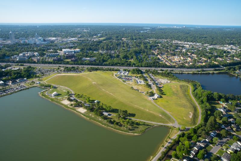 aerial view of a park with water on both sides of it