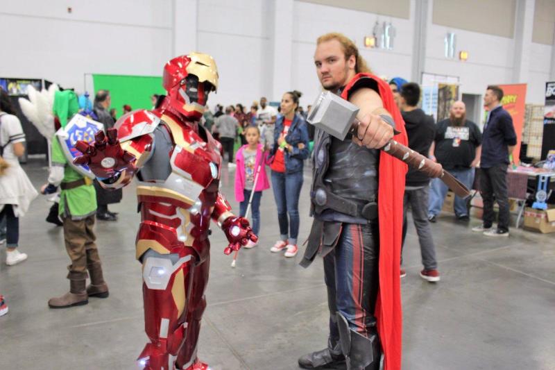 Comicon participants dressed as iron man and Thor
