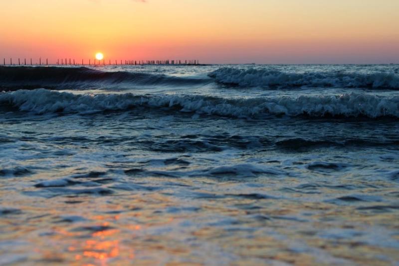 Sun setting on over the waves of the Chesapeake Bay