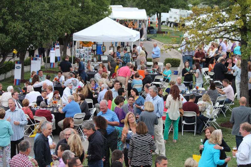 A large crowd gathers on the lawn at Bradley Fair for the Autumn & Art Festival in Wichita