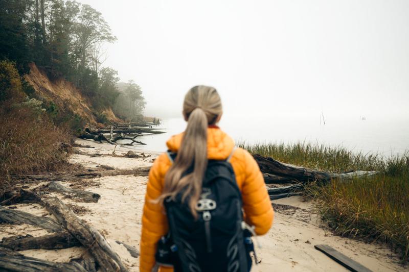 Woman hiking at York River State Park Fossil Beach