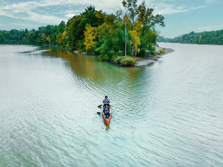 Two women paddling in canoe