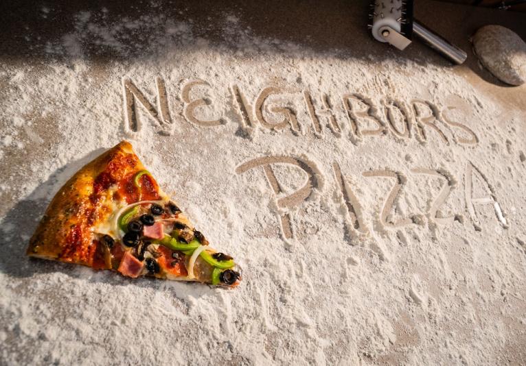 Neighbors Pizza Delivers