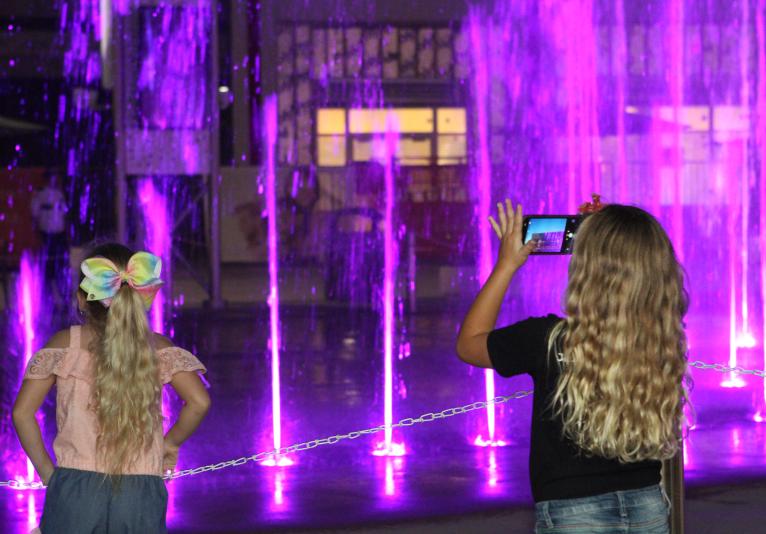 Girls watching Fountain Show at ONE DAYTONA