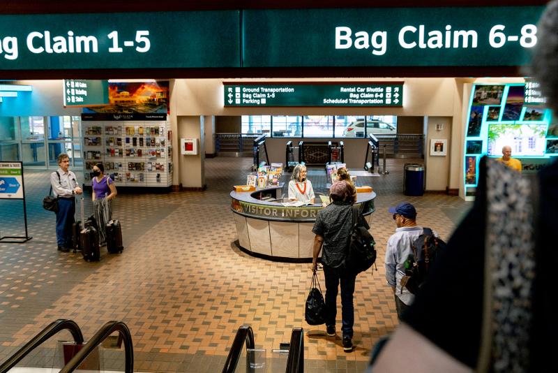A view of the Sunport Visitor Information Center at the bottom of the escalators of baggage claim at the Sunport.
