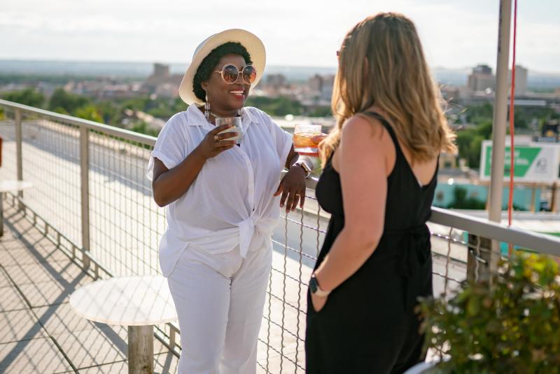 Women with drinks at Apothecary Lounge