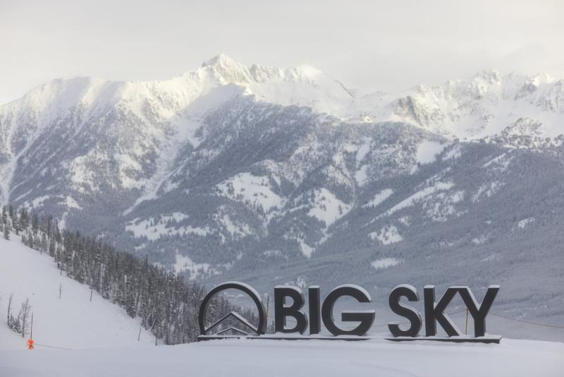 Big Sky sign with snowy mountain backdrop