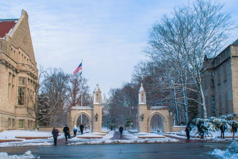 People walking through Sample Gates during winter