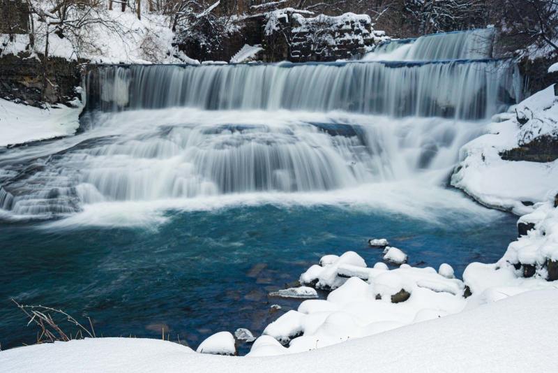 Seneca Mills Waterfall in winter on the Keuka Lake Outlet Trail in Finger Lakes Wine Country New York