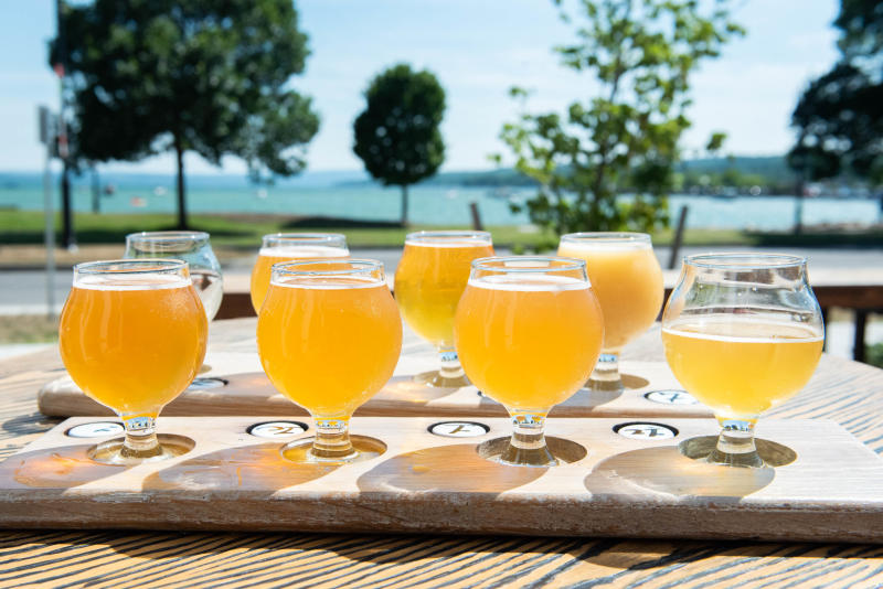 Goblets of beer overlooking Canandaigua Lake
