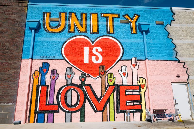 colorful mural with words unity is love
