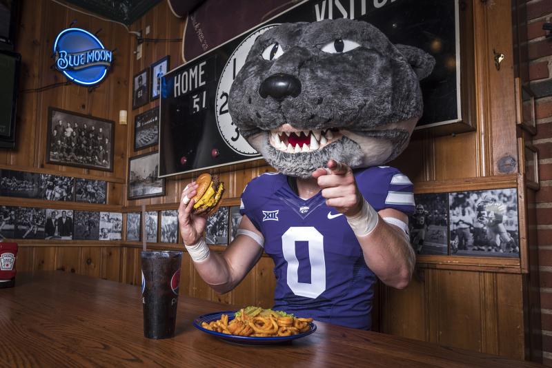 Willie the Wildcat eating at Kite's Bar and Grill